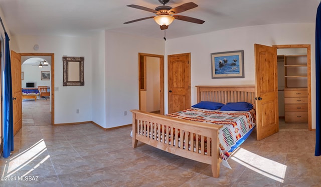 tiled bedroom with ceiling fan