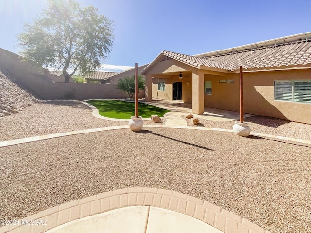 exterior space featuring ceiling fan, fence, and a patio