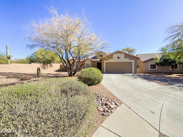 ranch-style house with a garage, concrete driveway, fence, and stucco siding