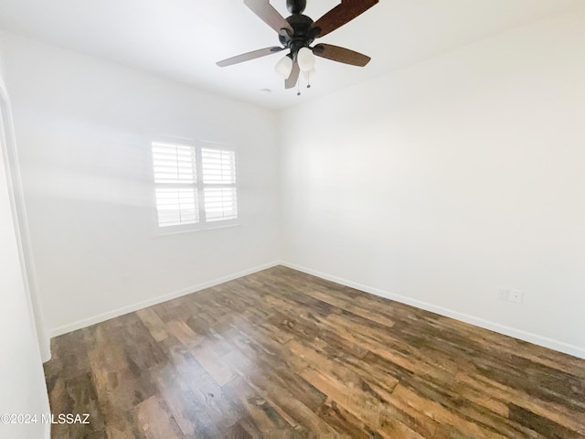 unfurnished room featuring ceiling fan, baseboards, and wood finished floors