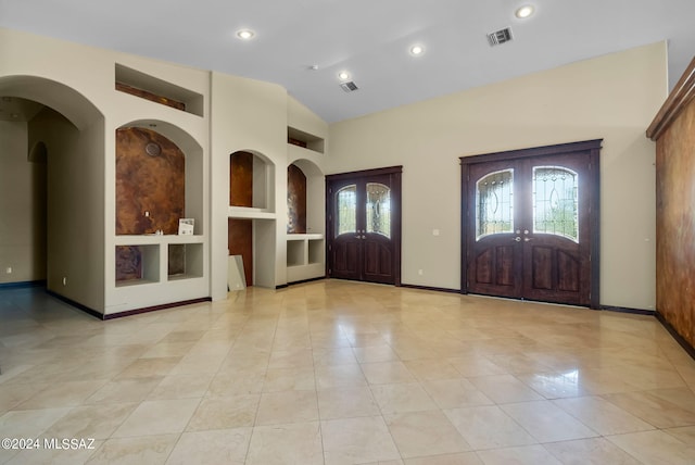 entryway featuring high vaulted ceiling, french doors, baseboards, and visible vents