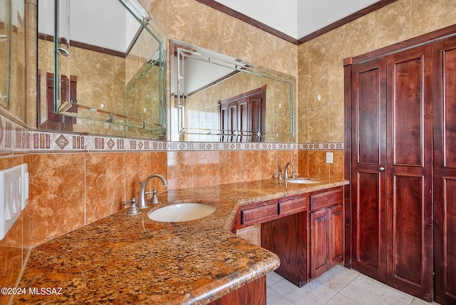 bathroom featuring a sink, backsplash, tile walls, and double vanity