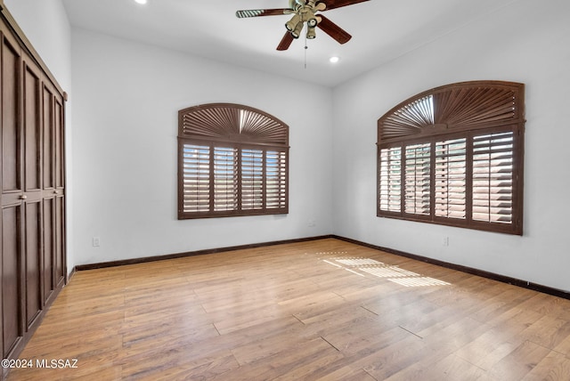 unfurnished bedroom featuring light hardwood / wood-style floors and ceiling fan