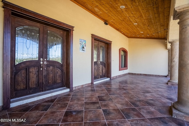 entrance to property with french doors and stucco siding