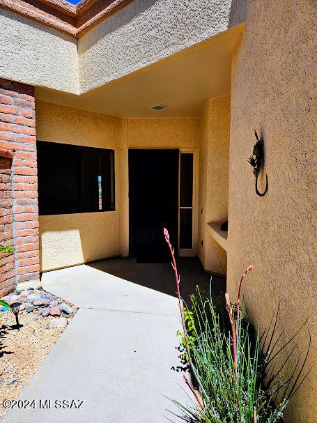 doorway to property featuring a patio