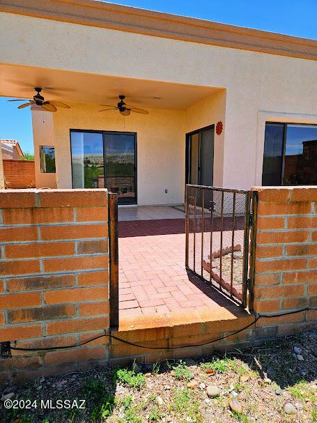 view of patio / terrace featuring ceiling fan