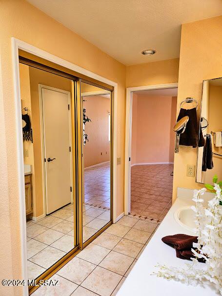 bathroom with tile patterned floors and vanity