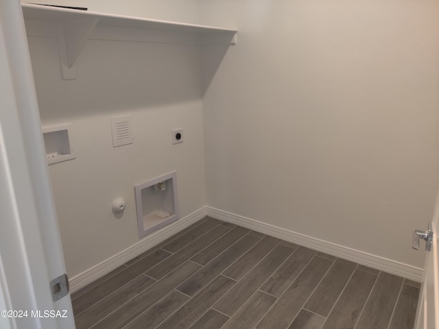 laundry room featuring laundry area, baseboards, and wood finish floors