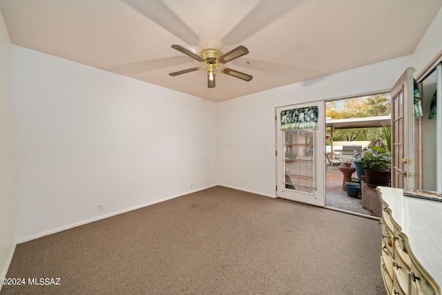 empty room with ceiling fan and carpet flooring