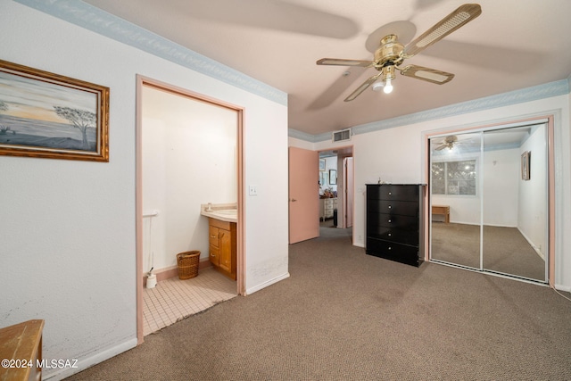 unfurnished bedroom featuring a closet, carpet, and ceiling fan