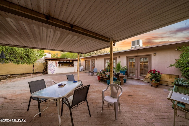 patio terrace at dusk with french doors