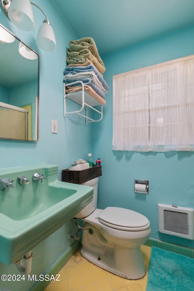 bathroom with tile flooring and toilet