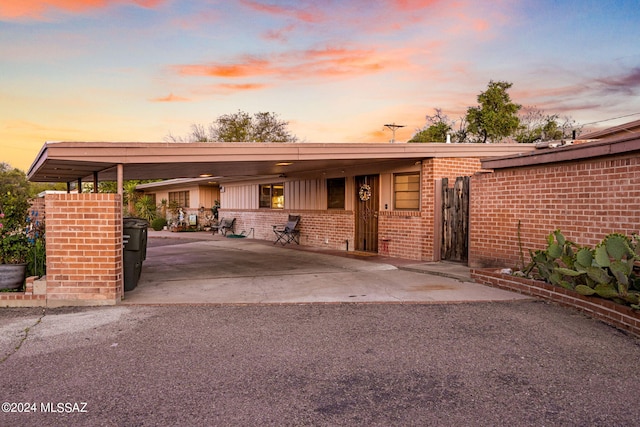 single story home featuring a carport