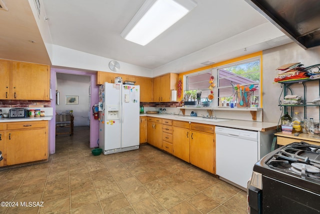 kitchen with sink, white appliances, light tile floors, and tasteful backsplash