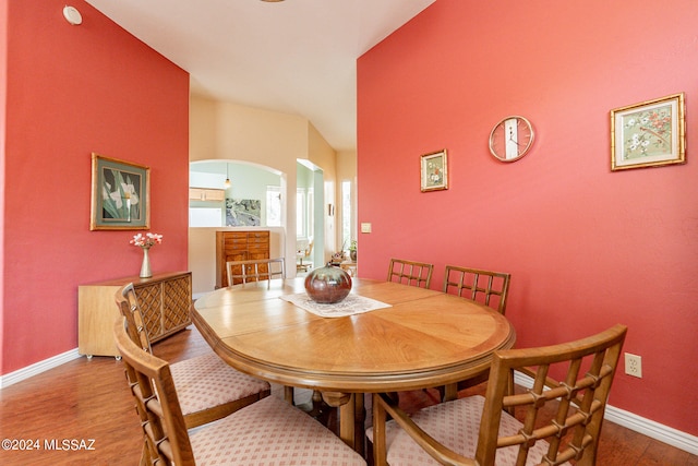 dining space with hardwood / wood-style flooring