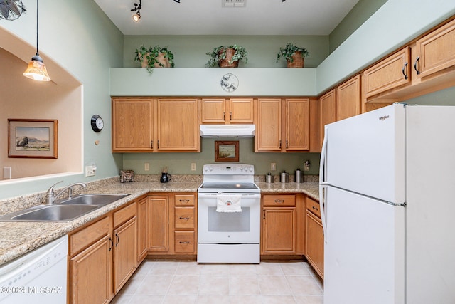 kitchen with light stone countertops, decorative light fixtures, white appliances, sink, and light tile floors