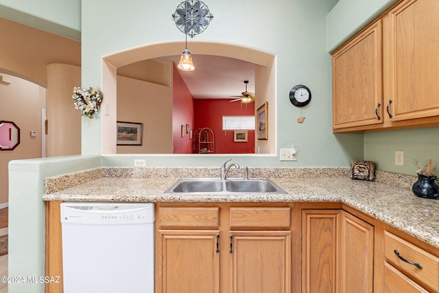 kitchen with decorative light fixtures, ceiling fan, sink, dishwasher, and light stone counters