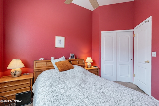 carpeted bedroom featuring a closet and ceiling fan