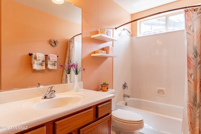 full bathroom with shower / tub combo with curtain, large vanity, and toilet