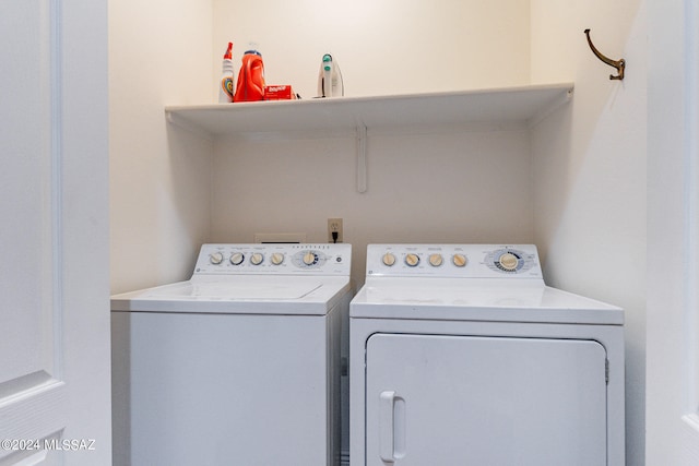 laundry room featuring washing machine and clothes dryer