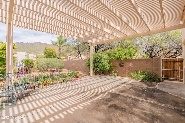 view of patio / terrace featuring a mountain view and a pergola