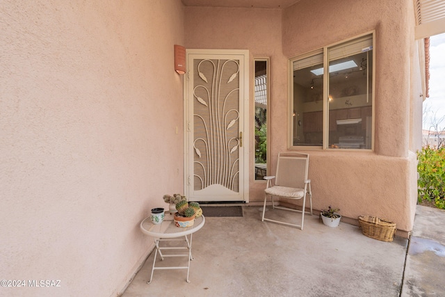 doorway to property with a patio area