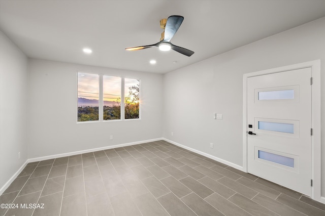 empty room featuring ceiling fan