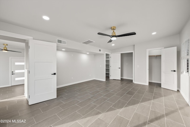 unfurnished bedroom with tile patterned flooring and ceiling fan