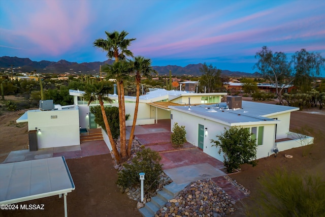 aerial view at dusk with a mountain view