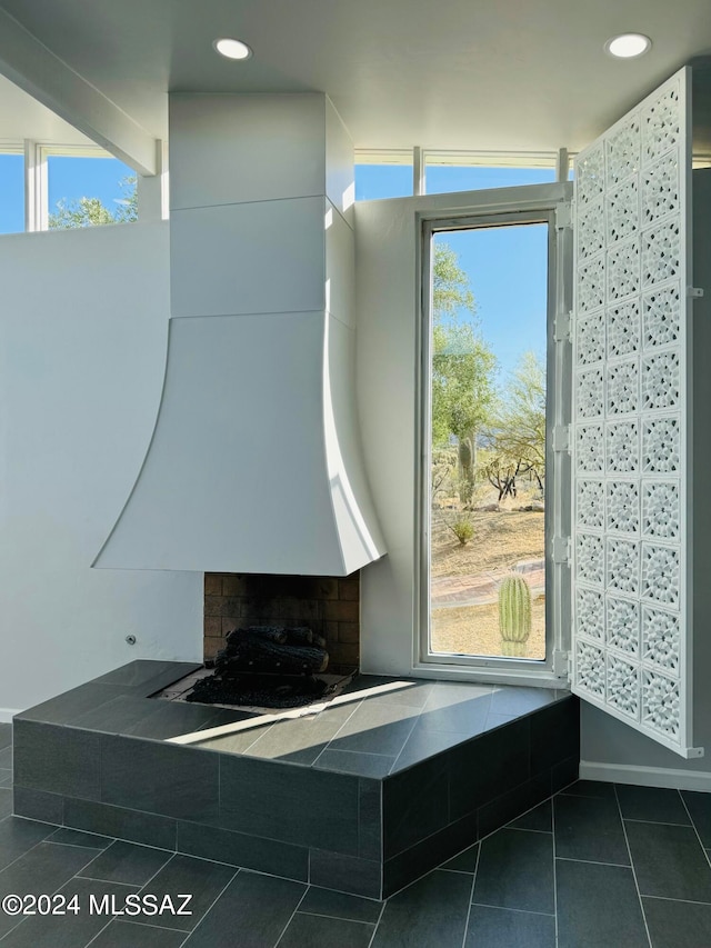 bathroom featuring tile patterned flooring and a wealth of natural light