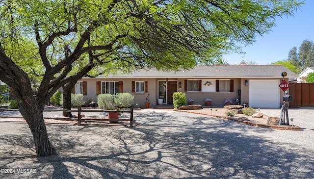 single story home with a garage