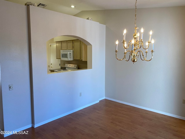 interior space with lofted ceiling, an inviting chandelier, and dark hardwood / wood-style floors