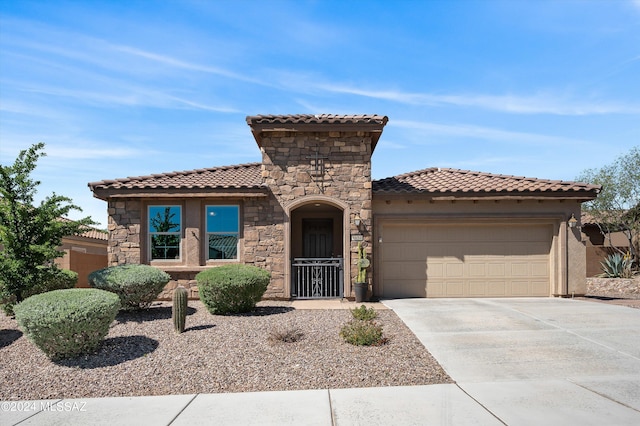 mediterranean / spanish-style house featuring a garage