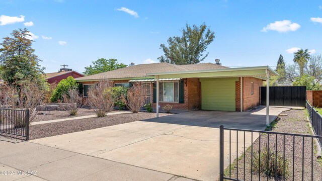 ranch-style house with a carport