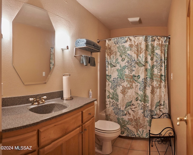 full bathroom featuring tile flooring, toilet, vanity, a textured ceiling, and shower / bathtub combination with curtain