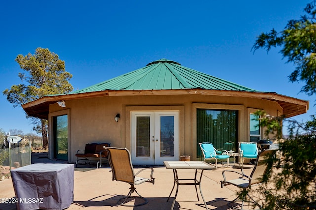 back of house featuring a patio area and french doors