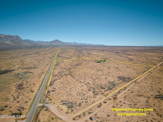 birds eye view of property with a mountain view