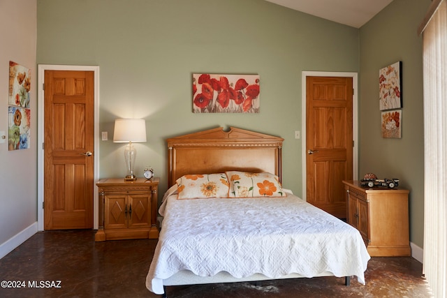 bedroom featuring vaulted ceiling