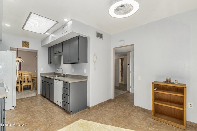 kitchen with sink and white appliances