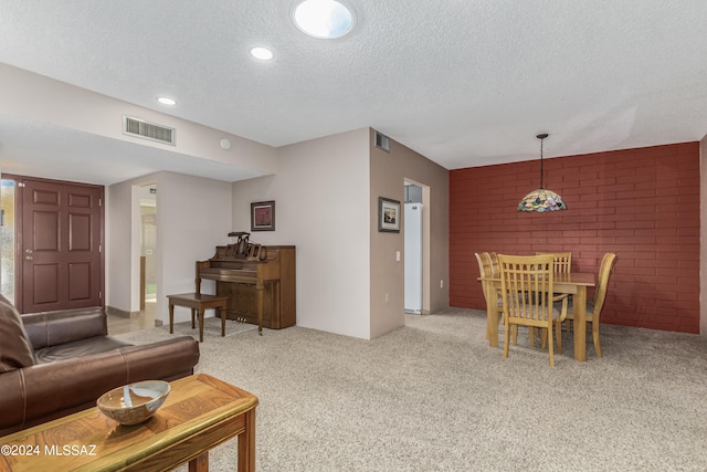 carpeted living room with a textured ceiling