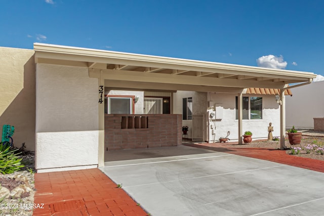 exterior space with a carport