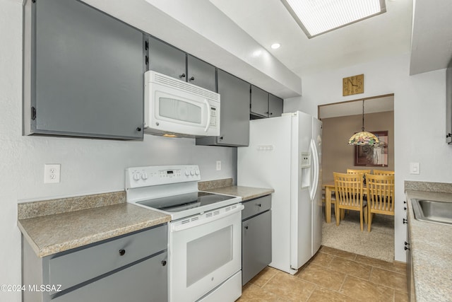 kitchen with white appliances, hanging light fixtures, gray cabinets, and sink