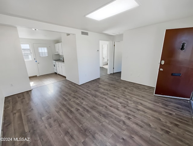 spare room with dark hardwood / wood-style floors