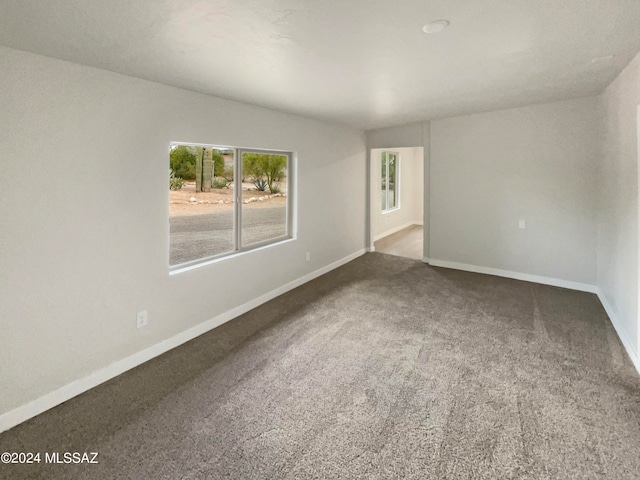 empty room featuring carpet flooring