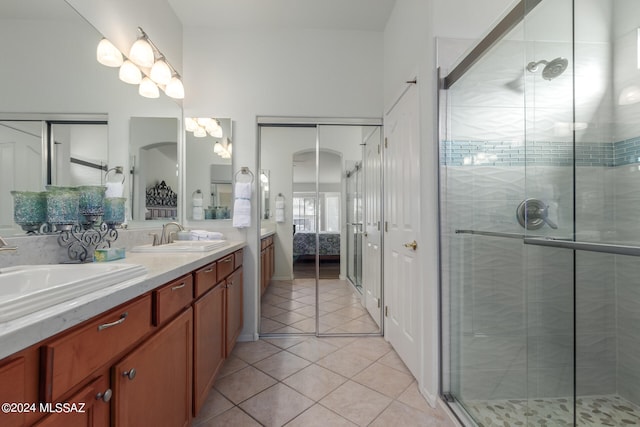 bathroom with vanity, tile patterned floors, and walk in shower