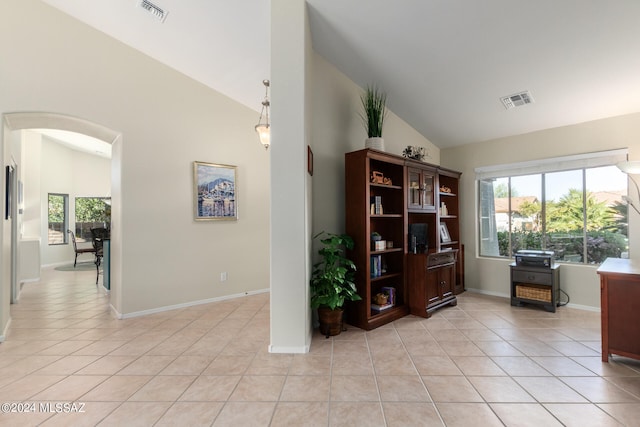 tiled home office with high vaulted ceiling