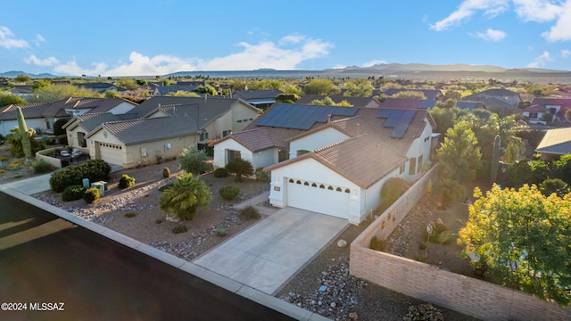 birds eye view of property with a mountain view