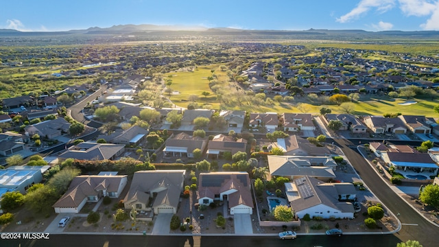 birds eye view of property with a mountain view