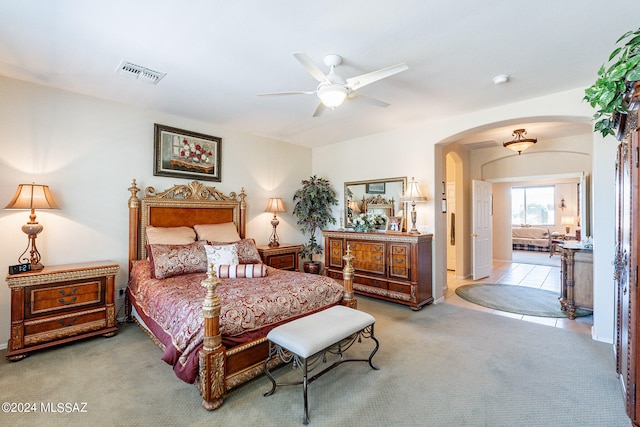 carpeted bedroom with ceiling fan