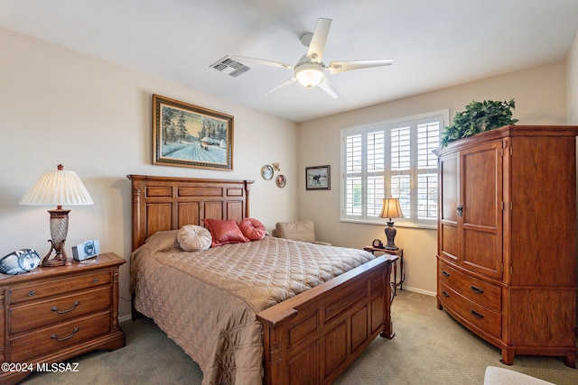 bedroom featuring light colored carpet and ceiling fan